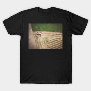 Aerial view of combine-harvester and tractor working in the field T-Shirt